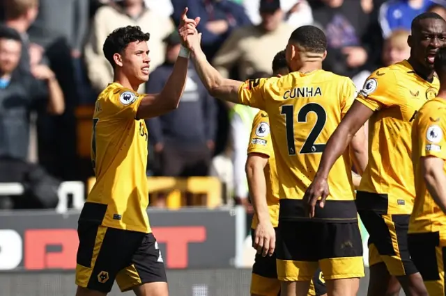 Matheus Nunes celebrates with team mates