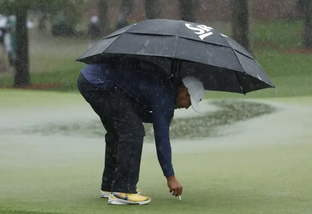 Koepka marks his ball