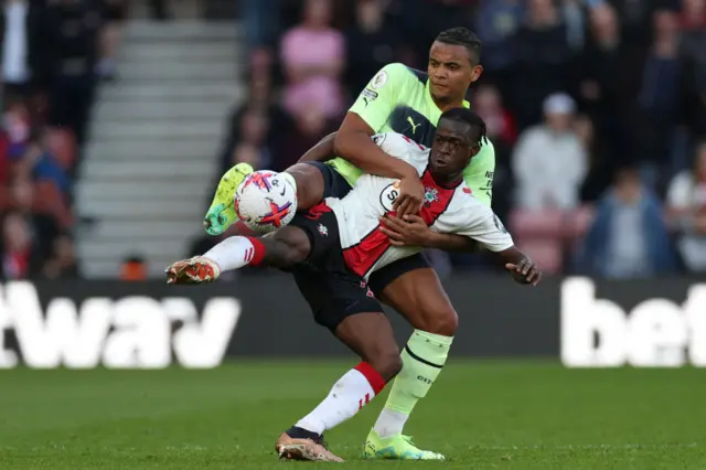 Manuel Akanji vies with Southampton's Ghanaian midfielder Kamaldeen Sulemana