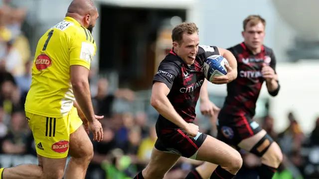 Max Malins carries the ball for Saracens