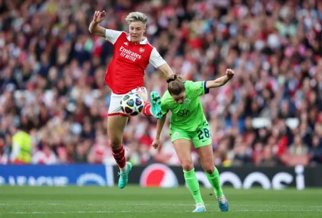 Hurtig directs the ball goalwards.