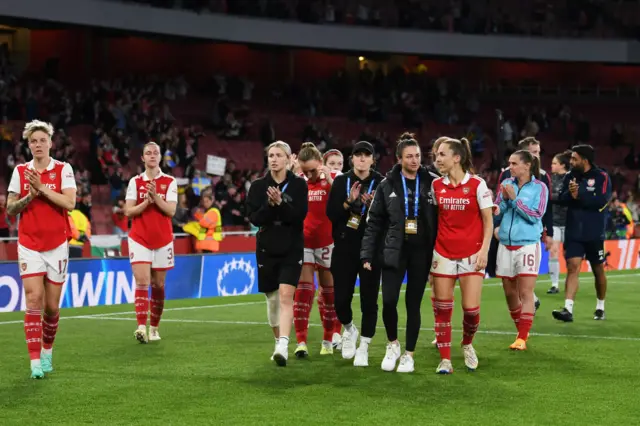 Arsenal players do a lap of honour to thank their fans.