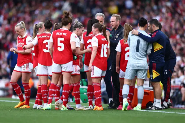 Jonas Eidevall gathers his players for a tactical briefing.