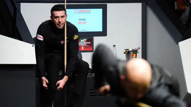 Mark Selby sits in his chair