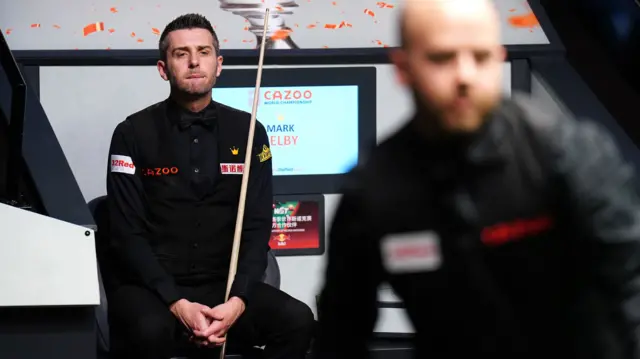 Mark Selby sits in his chair