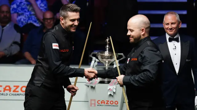 Mark Selby and Luca Brecel shake hands