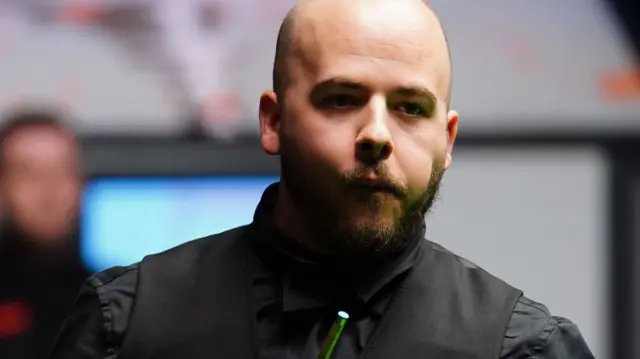 Luca Brecel ponders a shot