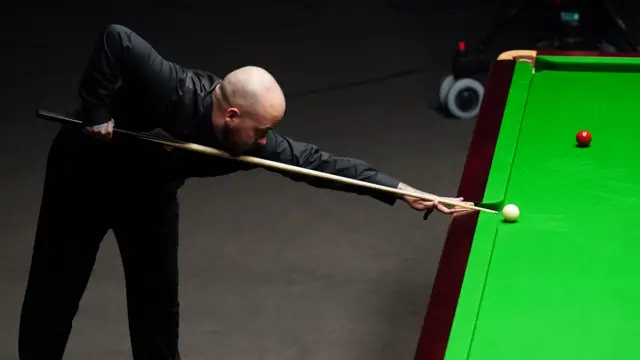 Luca Brecel plays a shot