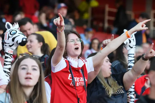 An Arsenal fan cheering