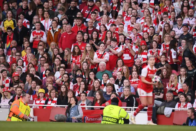 Arsenal fans watch on nervously.