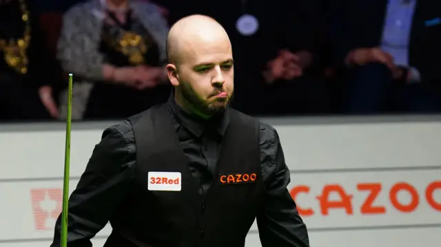 Luca Brecel ponders a shot