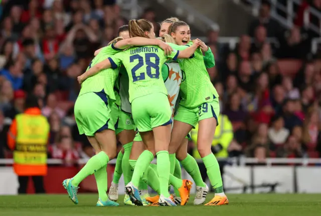 Wolfsburg celebrate their winner.