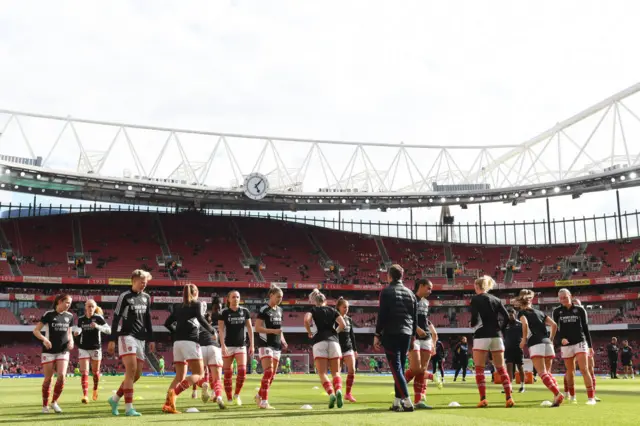 Arsenal warm up at the Emirates.