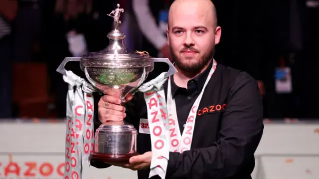 Luca Brecel with the World Championship trophy