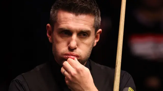 Mark Selby puffs out his cheeks