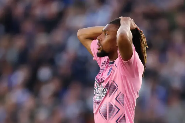 Everton's Alex Iwobi reacts to his shot being saved by Daniel Iversen