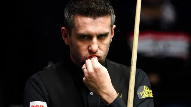 Mark Selby ponders a shot