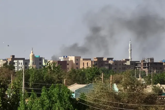 Smoke billows in Khartoum amid ongoing fighting between the forces of two rival generals.