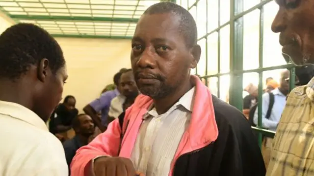 Self-proclaimed pastor Paul Nthenge Mackenzie, (C) who set up the Good News International Church in 2003 and is accused of inciting cult followers to starve to death "to meet Jesus", appears at the Shanzu law courts in Mombasa on May 5, 2023