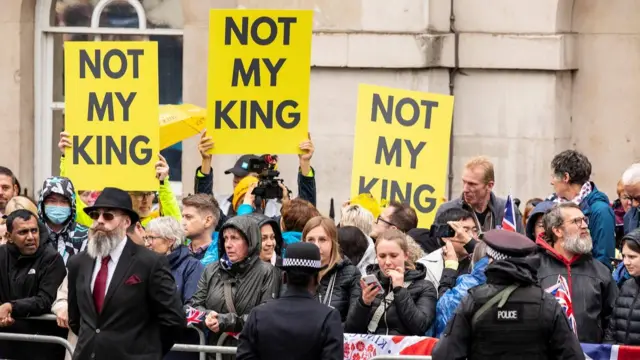 Republicans and anti monarchist's protest in the crowd at Whitehall