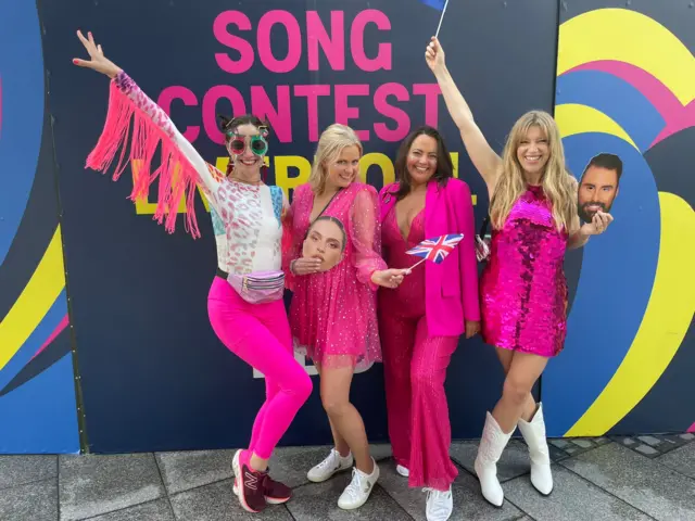 Katie, Hannah, Sharon and Jo pose in pink outfits