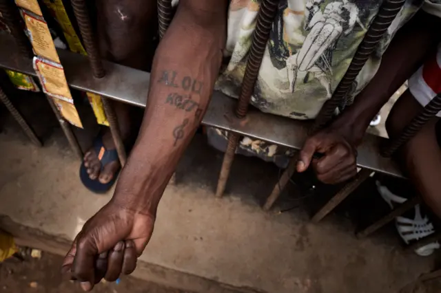 A detainee shows his tatoos at the Bamako Central Prison in Bamako on July 3, 2020.