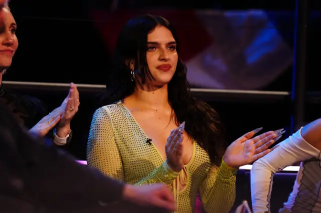 Mae Muller of the United Kingdom watching the acts during the semi-final 2 of Eurovision Song Contest at the M&S Bank Arena in Liverpool.