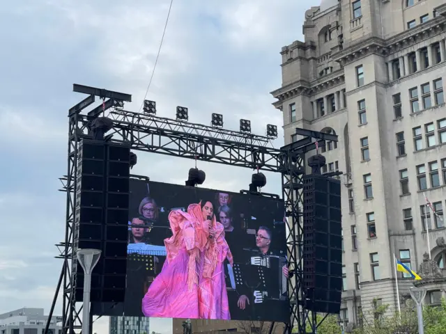 Ukraine's 2016 Eurovision winner Jamala performs on a big screen