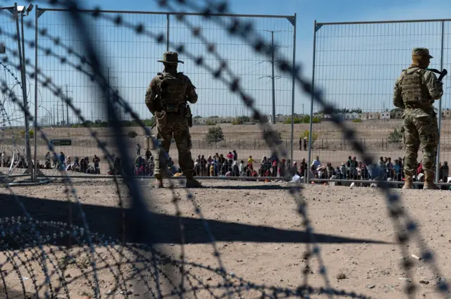 US soldiers guard the US side of the border