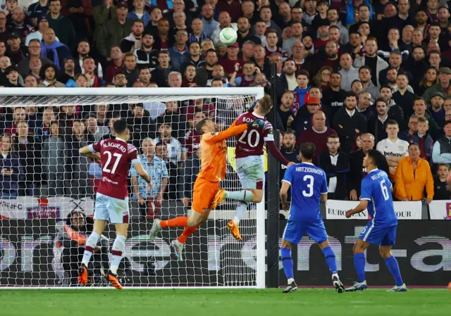 Matt Ryan punches Jarrod Bowen in the face.