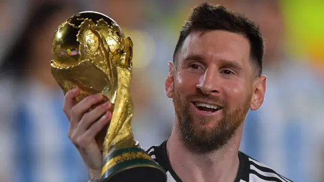 Lionel Messi lifts the World Cup