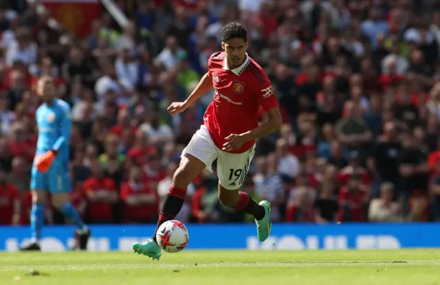 Varane dribbbles the ball slowly out from the back.