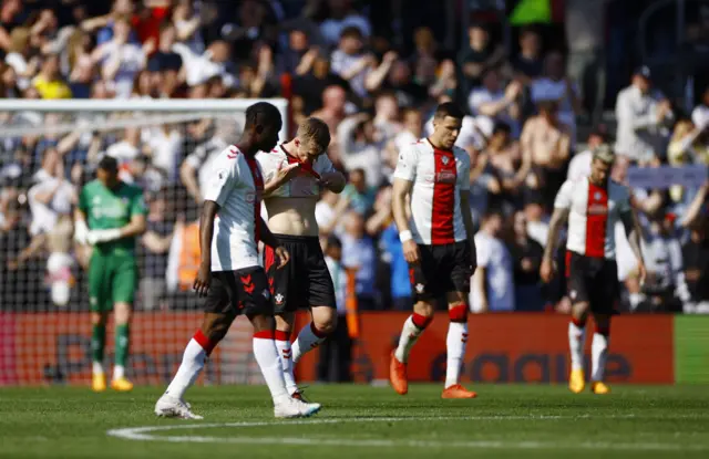 Southampton players stand lost after conceding again.