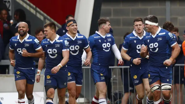 Sale Sharks celebrate scoring a try