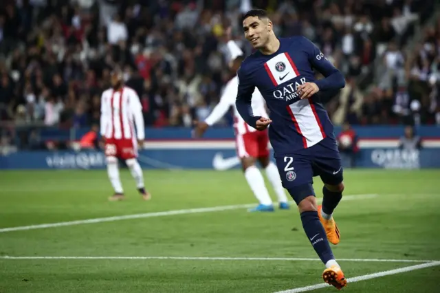 Achraf Hakimi celebrates scoring the second goal for PSG.