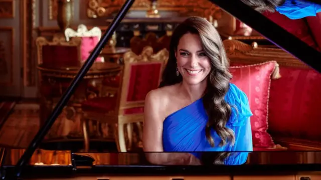 Princess of Wales sits at a piano