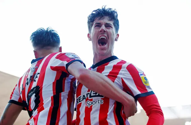 Trai Hume celebrates scoring for Sunderland against Luton