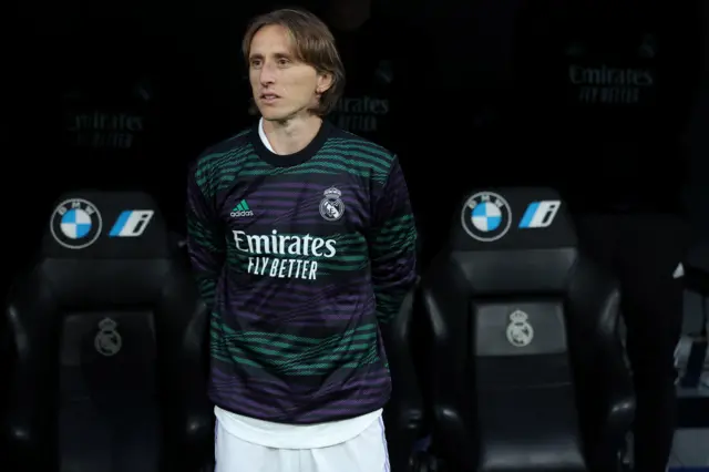 Luka Modric watches on from the sidelines.