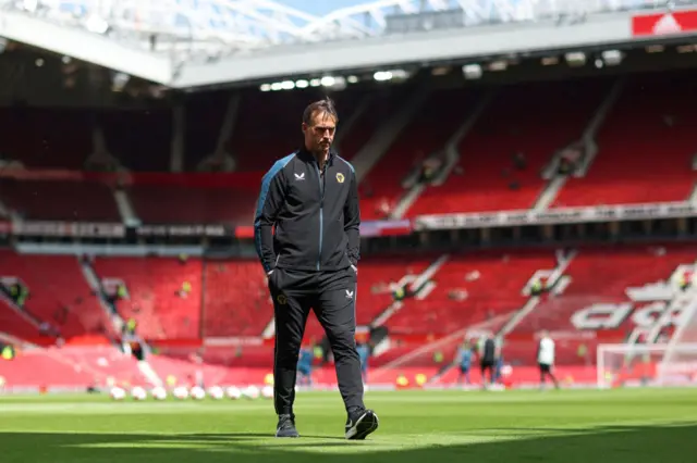 Lopetegui assesses the Old Trafford pitch.