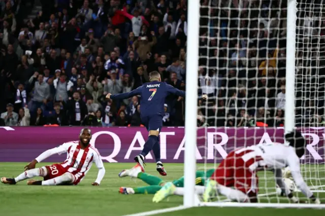 Mbappe wheels away in celebration after scoring for PSG