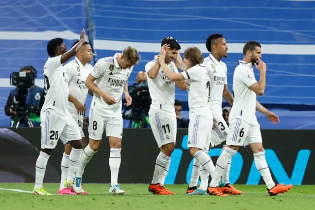 Marco Asensio celebrates scoring the sole goal of the game so far.