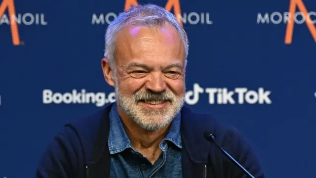 ​​Graham Norton speaks during a press conference on the eve of the final of the Eurovision Song contest 2023 at the M&S Bank Arena in Liverpool, northern England on May 12, 2023