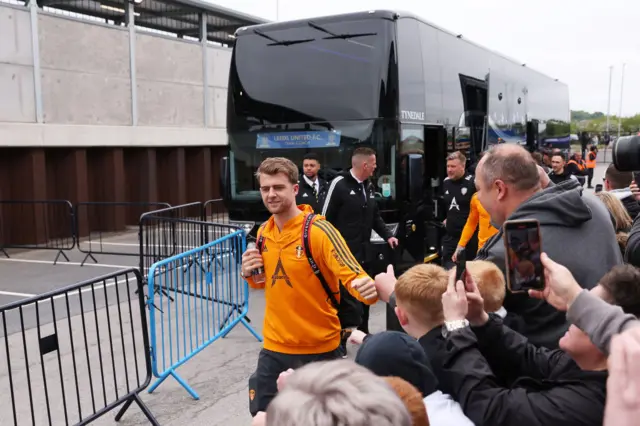 Patrick Bamford is greeted by Leeds fans.