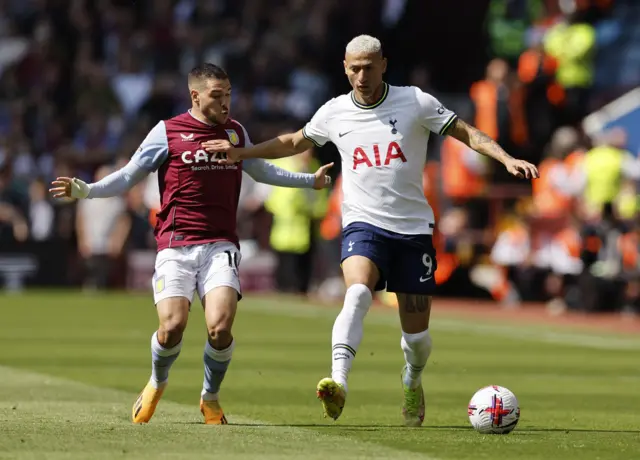 Aston Villa's Emiliano Buendia in action with Tottenham Hotspur's Richarlison