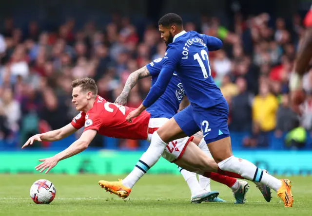 Ryan Yates of Nottingham Forest is challenged by Ruben Loftus-Cheek of Chelsea