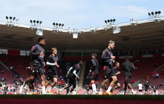 Southampton players warm up ahead of their game v Fulham.