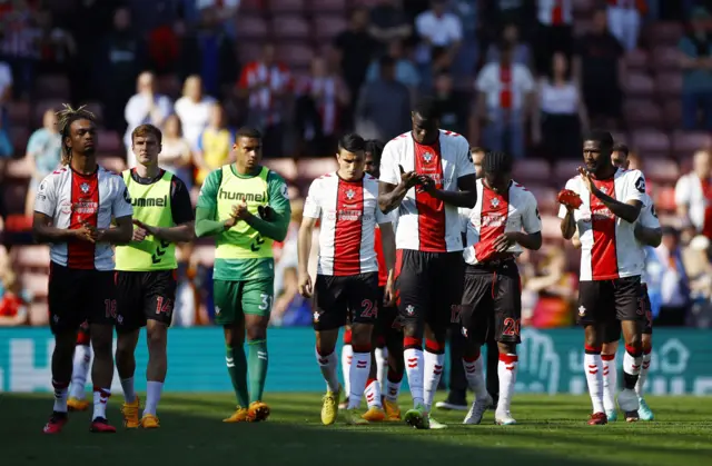 Southampton players thank fans who stayed until the end of the game.