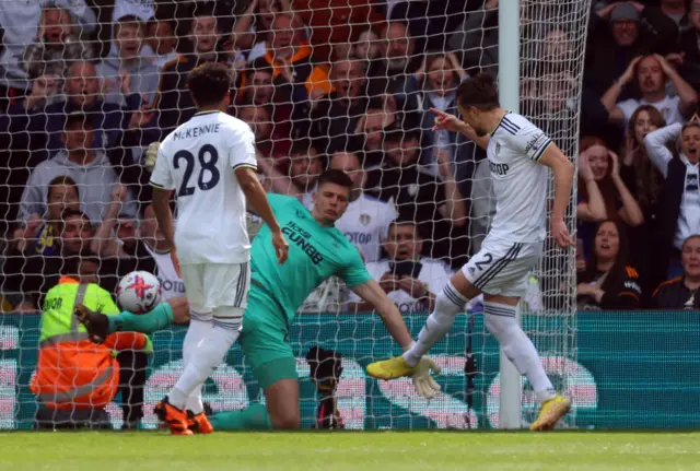 Luke Ayling stabs home the opener for Leeds.