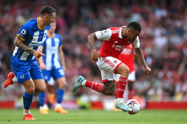 Brighton's Lewis Dunk chases down Arsenal's Gabriel Jesus