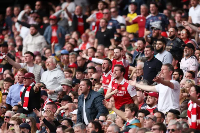 Arsenal fans react angrily during the team's defeat by Brighton